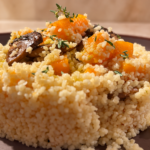 Cous cous con zucca e funghi, timo fresco e Olio al Tartufo Nero